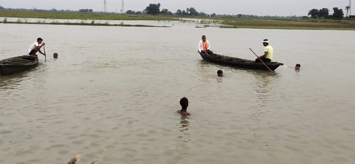 one girl and three child dip in river