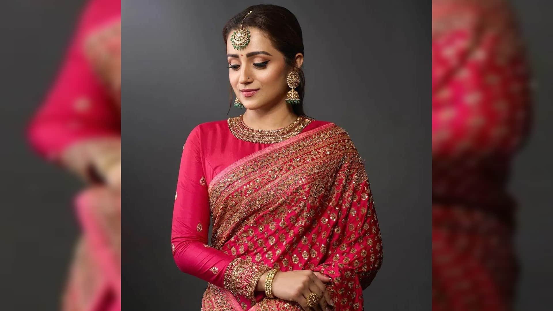 trisha krishnan in bright pink saree with heavy embroidery and maang tikka for movie ponniyin selvan trailer l