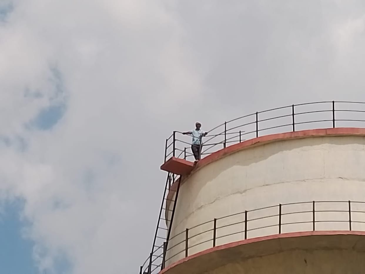 ... so that's why the young man climbed on the water tank