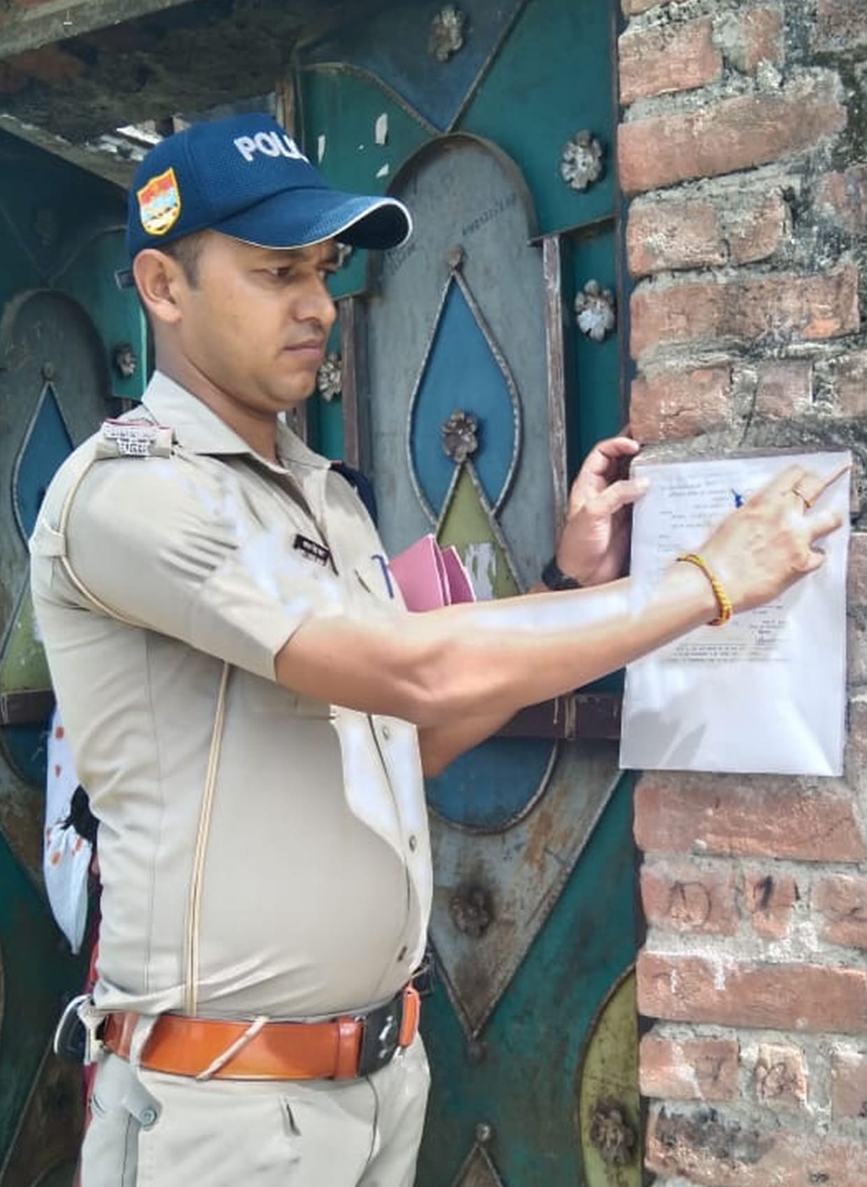 Notice pasted on the houses of the absconding accused in the case of attack on the police