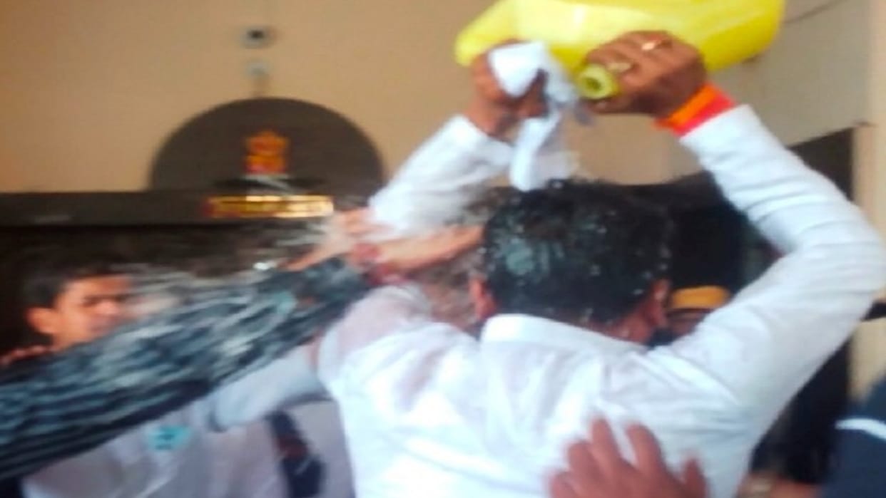 Outside the DM office, the young man poured kerosene on himself, mother and brother