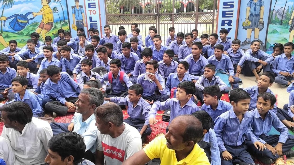 Children lock the school gate in Turkiawas