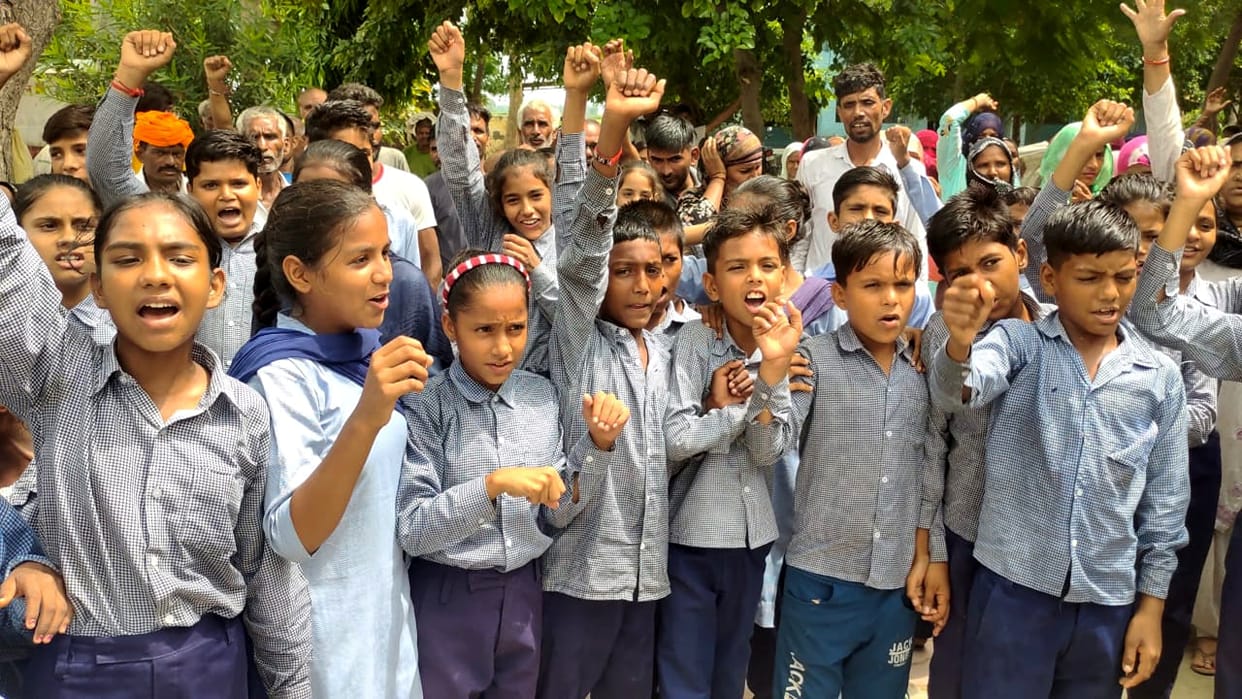 Angry villagers protest outside school due to lack of teachers