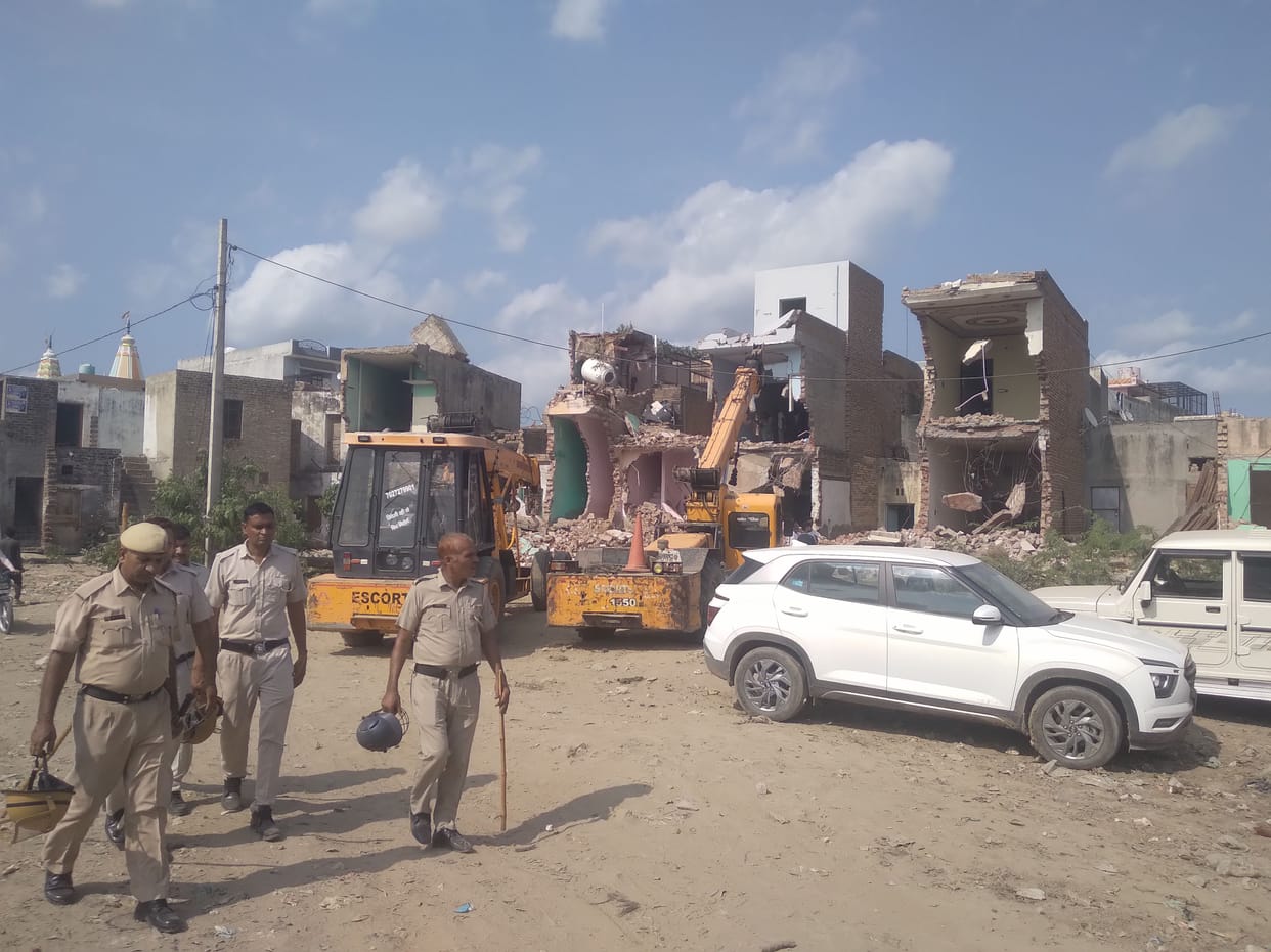Shop built on railway land and bulldozers run on houses