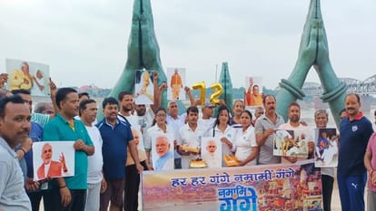 PM Modi birthday live updates Milk ceremony on PMs birthday celebrated by cutting cake at Namo Ghat