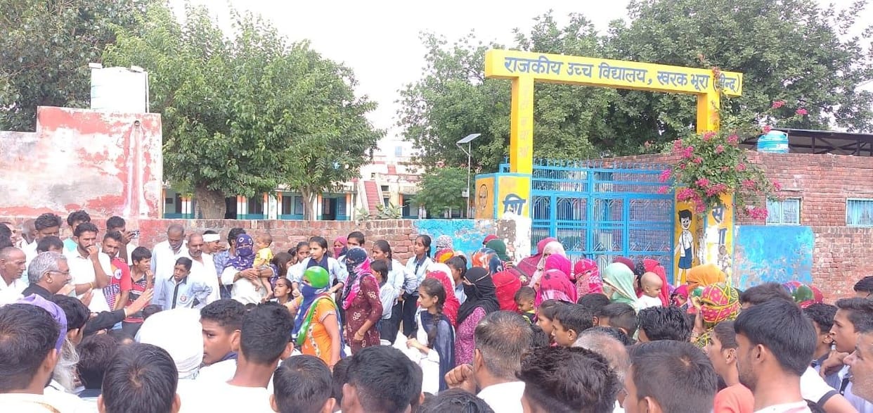 Students lock the gate of Government High School of Kharakbhura