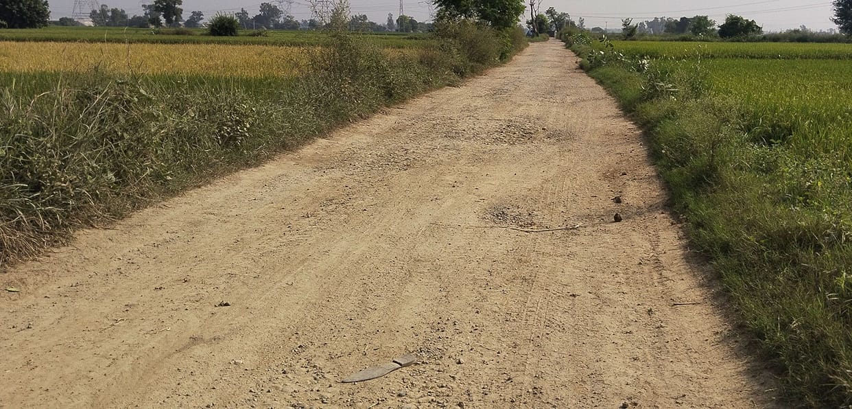 Villagers demand to fill potholes on the road