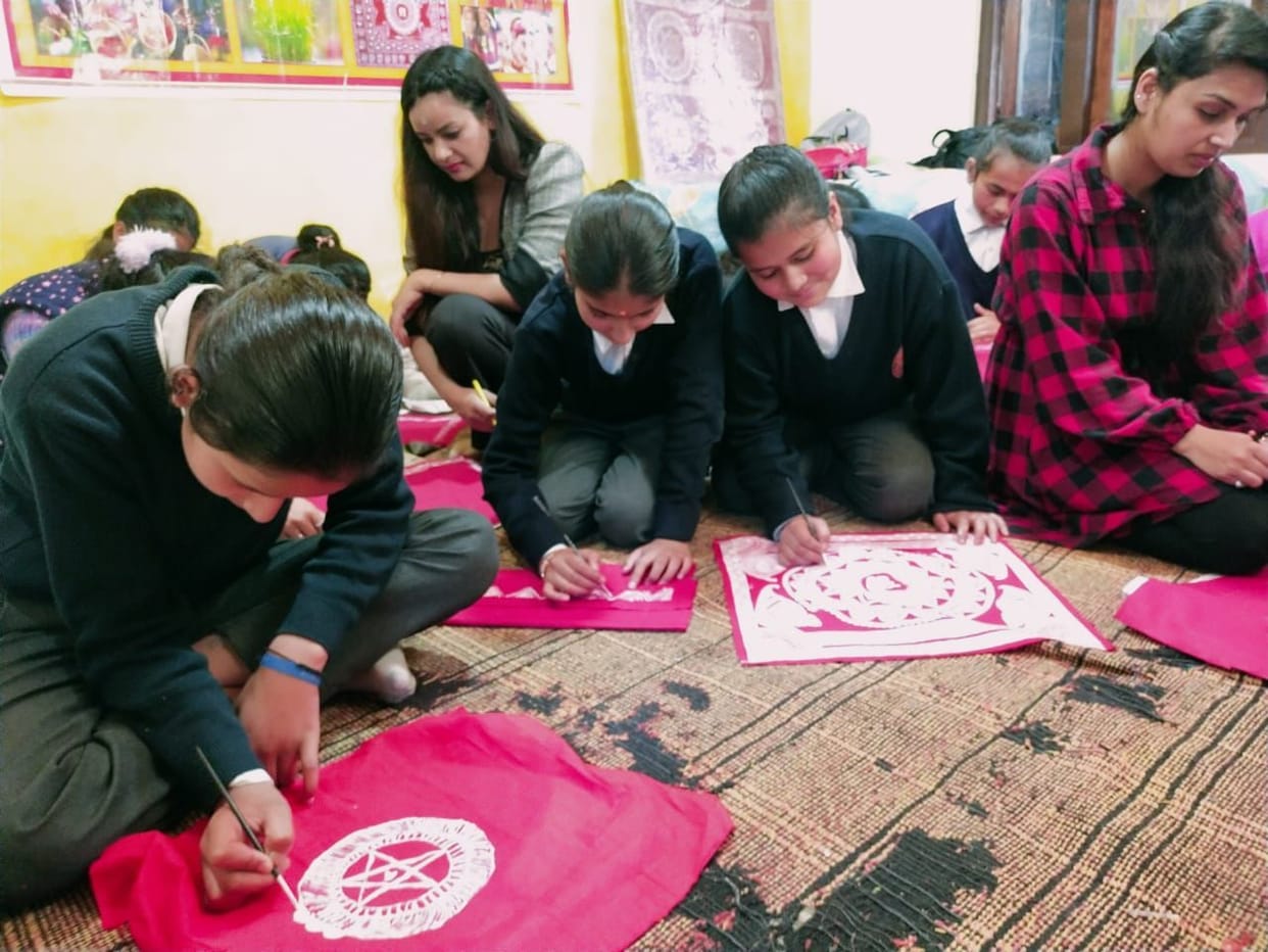Participants took information about Aipan in Kumaon Festival