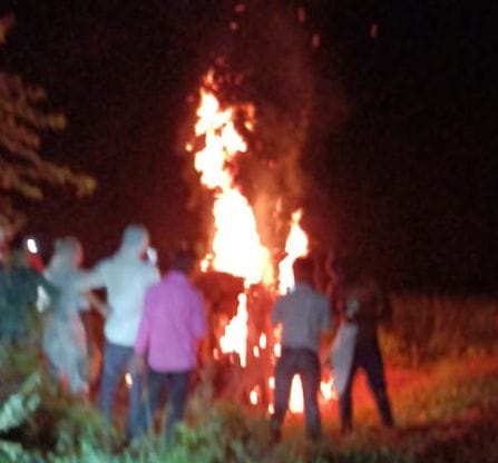Last rites performed in torchlight