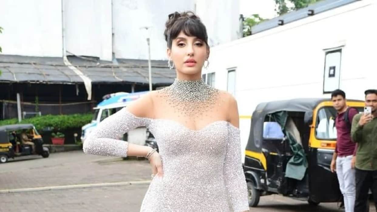 nora fatehi latest look from jhalak dikhla jaa set wear silver pink shimmer gown teases fans with tight fittin