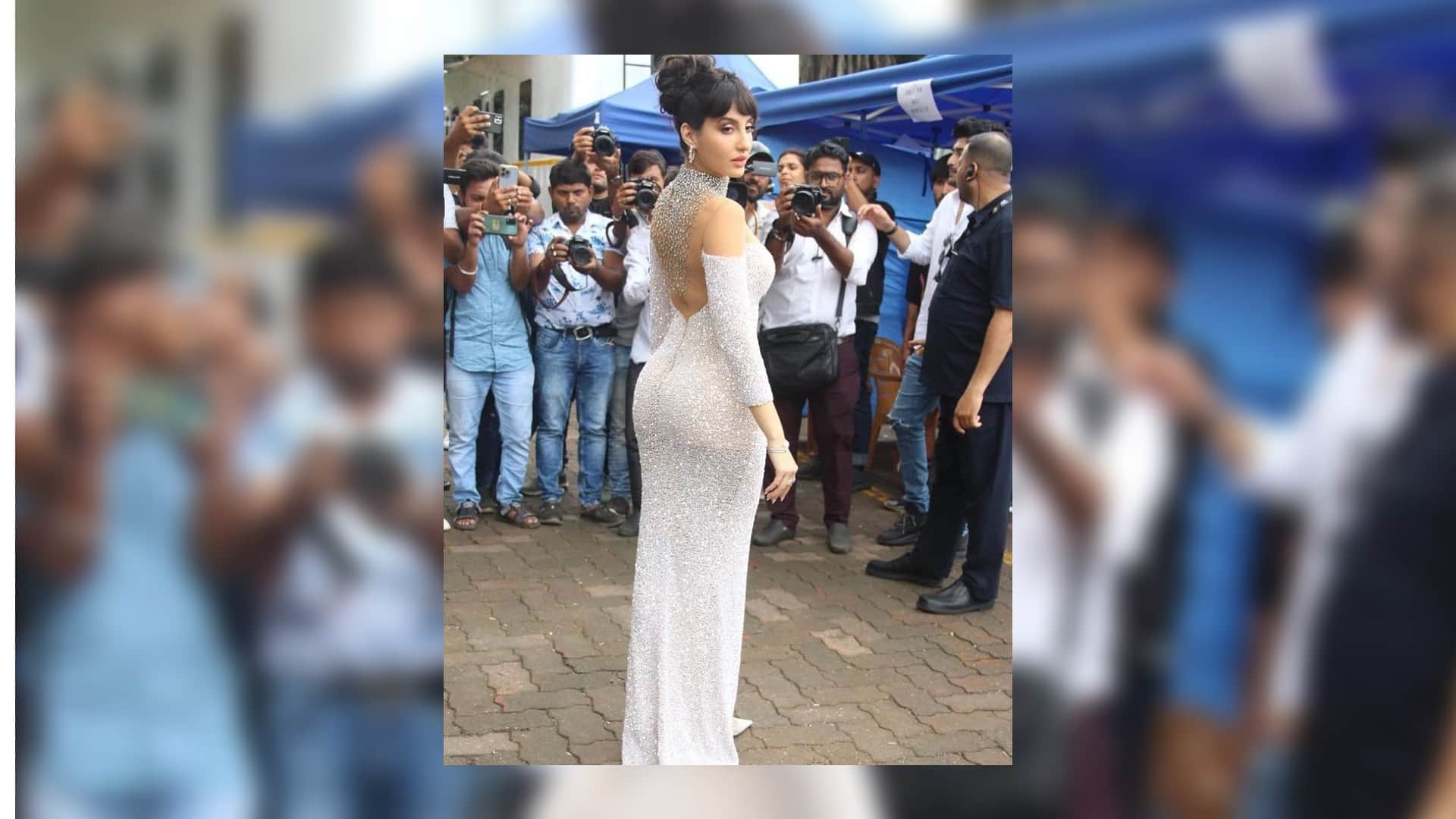 nora fatehi latest look from jhalak dikhla jaa set wear silver pink shimmer gown teases fans with tight fittin