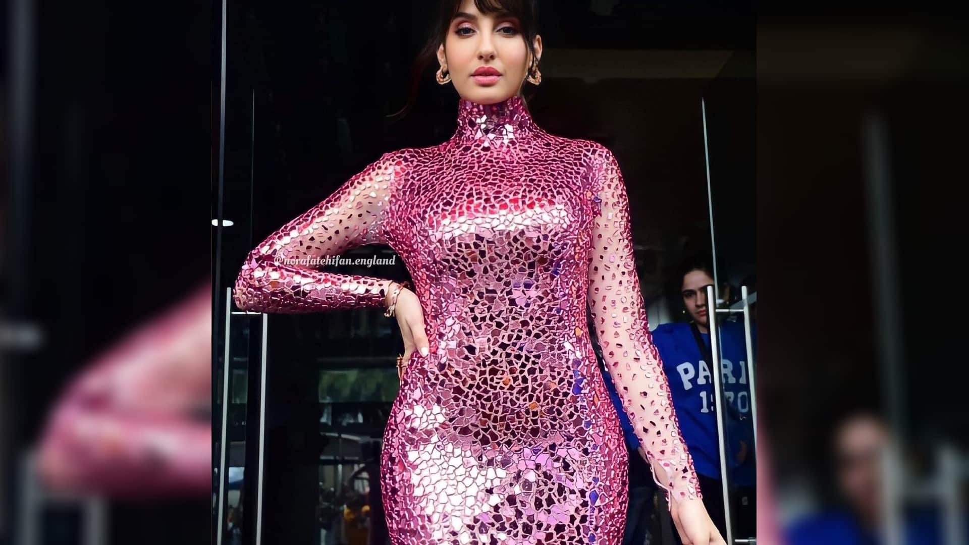 nora fatehi latest look from jhalak dikhla jaa set wear silver pink shimmer gown teases fans with tight fittin