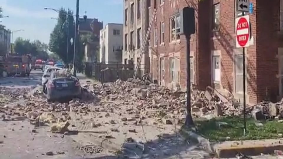 A red-brick building partially collapsed in an explosion on Chicago West Side yesterday