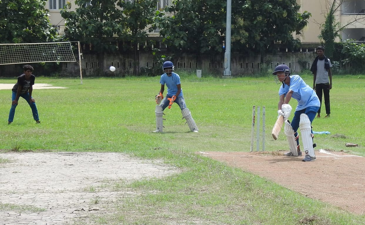 girls practicing cricket