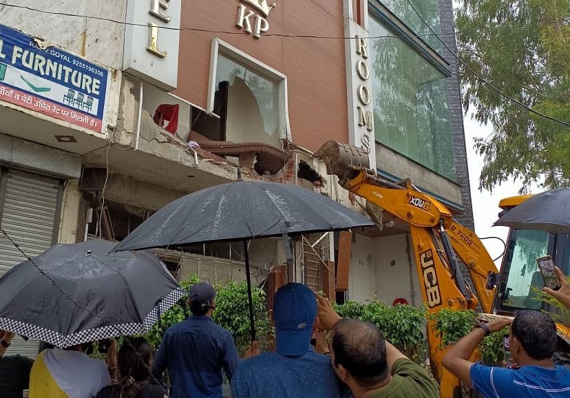 Bulldozer on drug dealer's luxurious hotel, front demolished