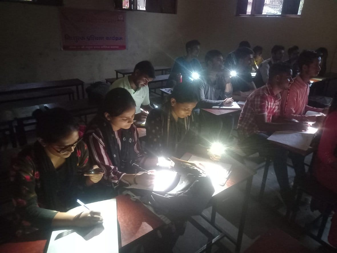 Coaching class in the light of mobile phone torch