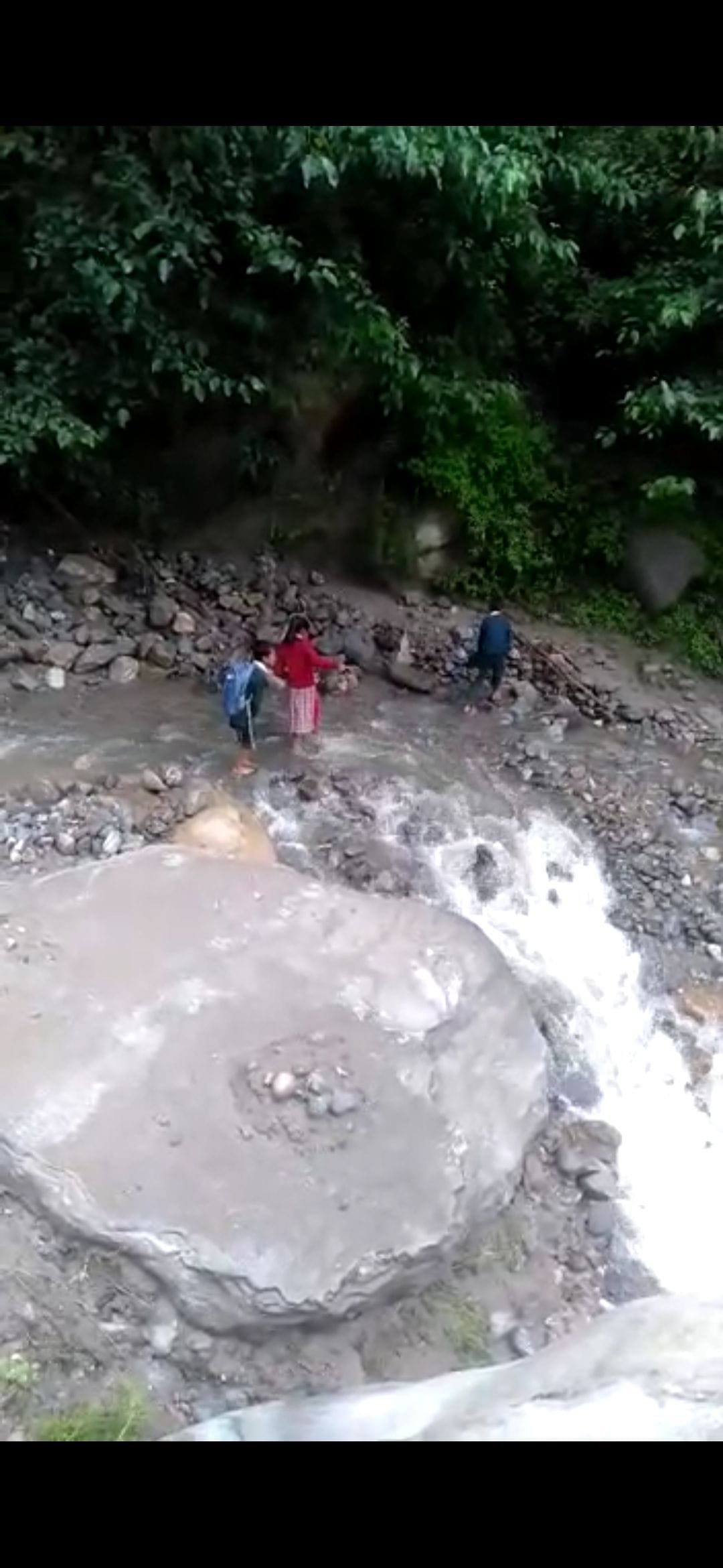 students reach school after crossing khad