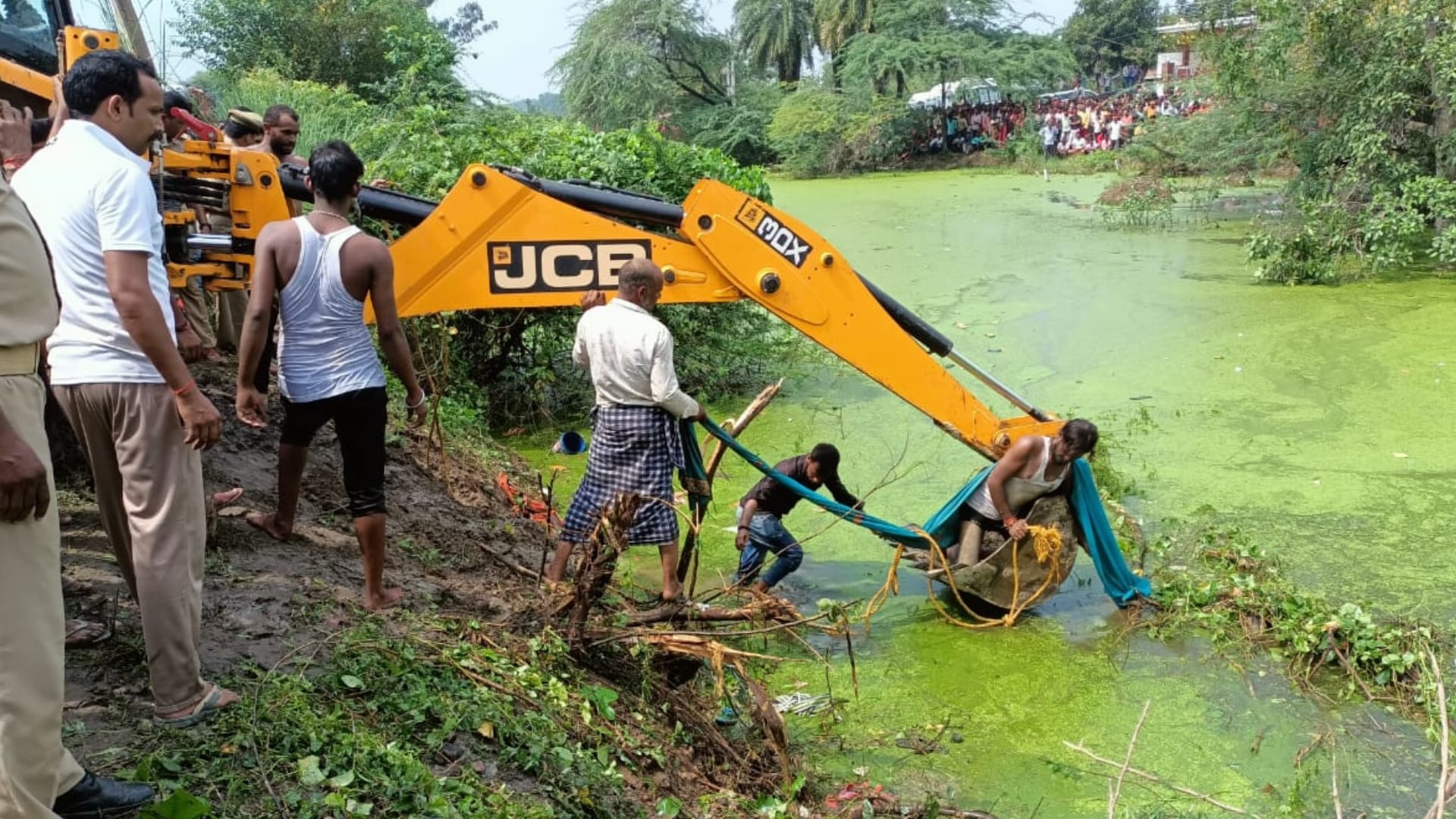 A tractor trolly falls in a pond in Itaunja in Lucknow.