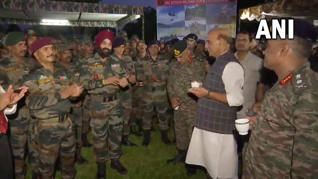 Army jawans sing a song as Defence Minister Rajnath Singh interacts with them Dinjan military station