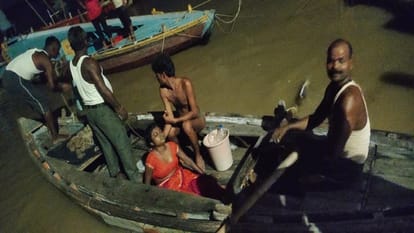 Woman jumps in Ganges with two year old child Sailors save woman child drowns