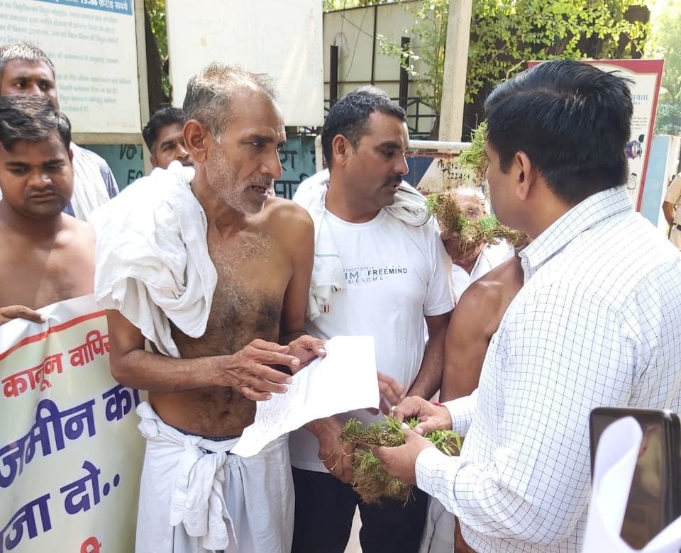 Farmers demonstrated outside the small secretariat by being half-naked