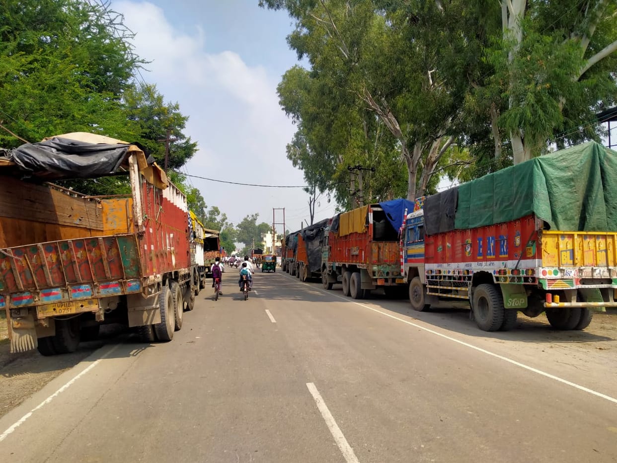 Trucks parked on the side of the road becoming a hindrance to safe traffic