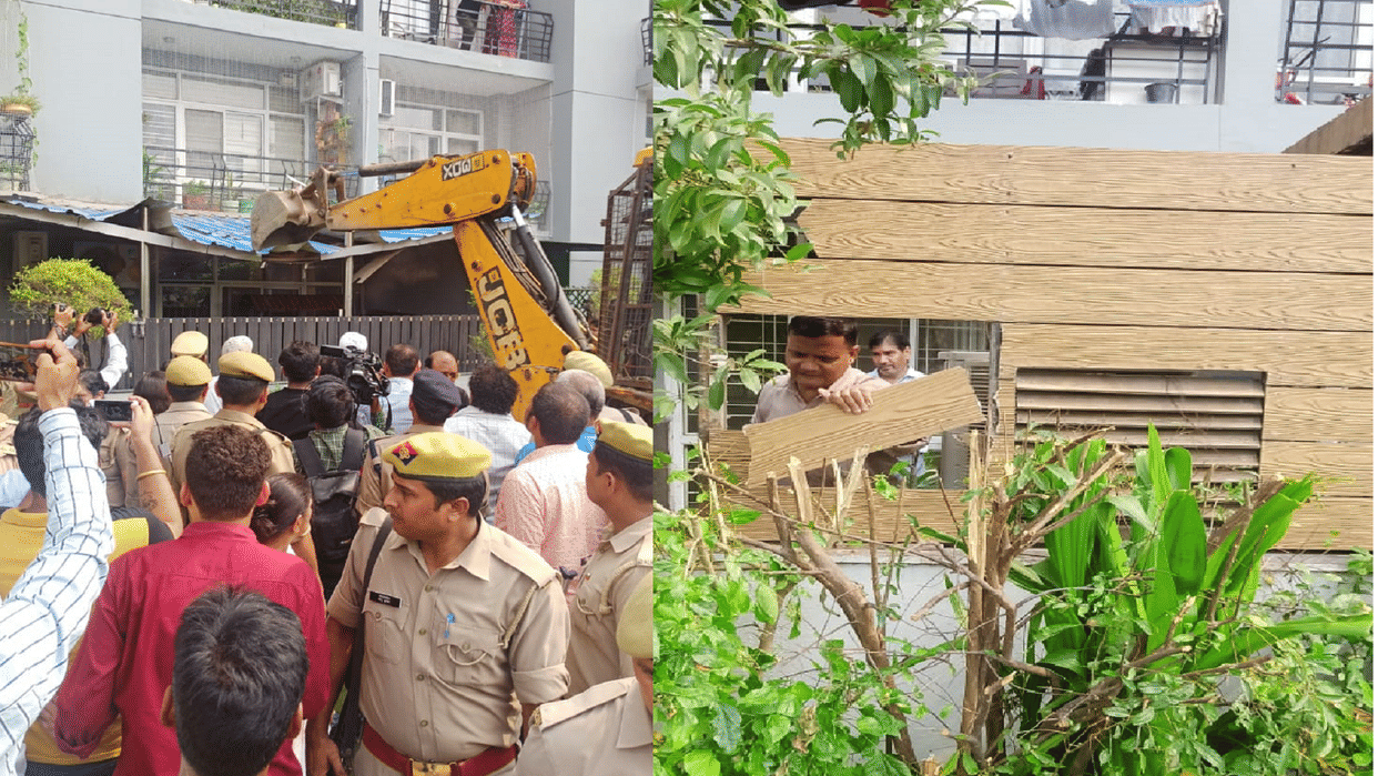 Grand Omaxe Society Residents lock gate bulldozer is outside
