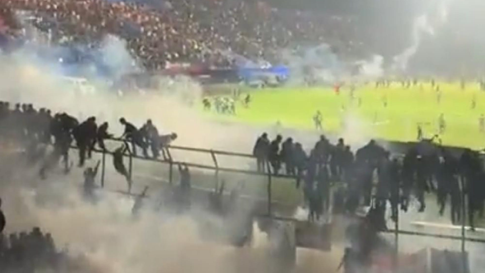 Indonesia Football Riot violence people dead crying Arema FC and Persebaya Surabaya match pictures