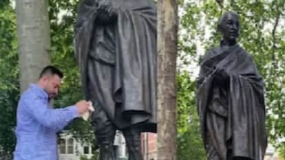 लंदन में गांधी की प्रतिमा की गंदगी साफ करते हुए बिहार के उपमुख्यमंत्री तेजस्वी यादव