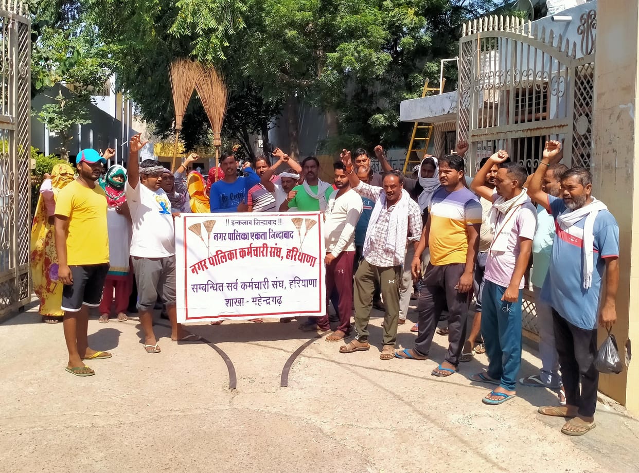 Cleaners demonstrated with a broom, warned of strike