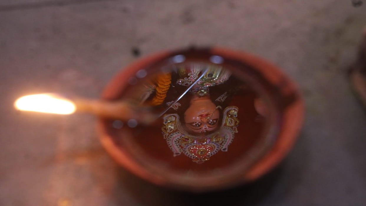 The statue of the mother emerged in the lamp people swayed in the garba