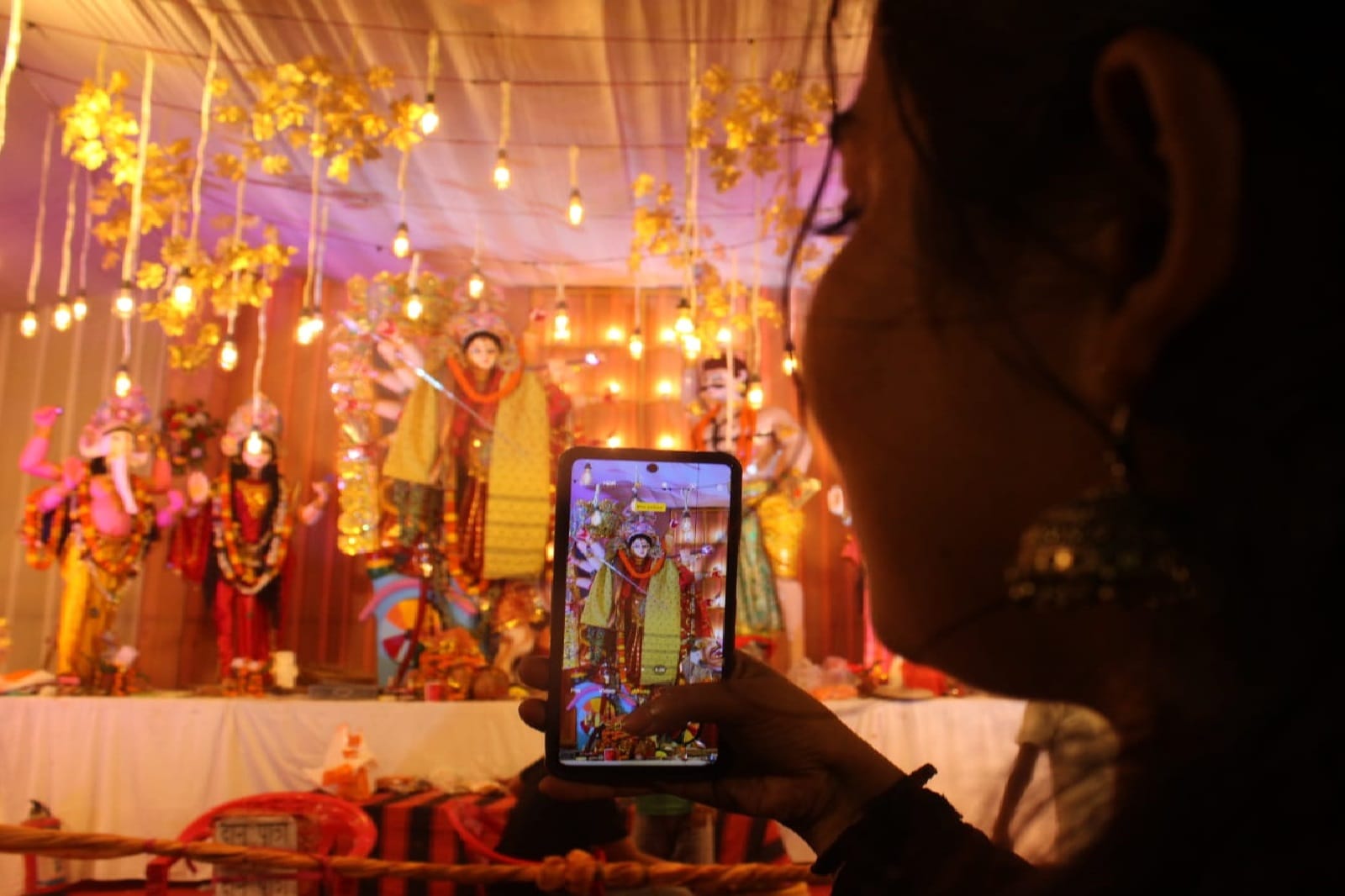 The statue of the mother emerged in the lamp people swayed in the garba