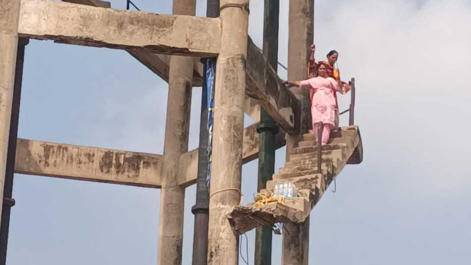 Two teachers climb a water tank protesting against Punjab govt in Mohali