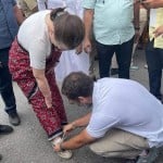 Rahul Gandhi tying the shoelaces of Sonia Gandhi during Bharat Jodo Yatra