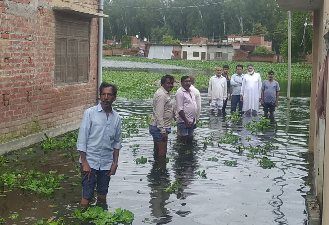 Standing in water and protesting against waterlogging