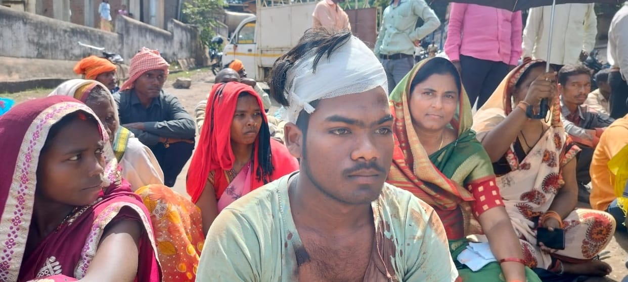 Villagers sitting on dharna when the security personnel beat them alleging theft