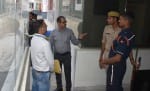 चांदपुर स्थित प्लांट पर छापे के दौरान मौजूद अधिकारी।
