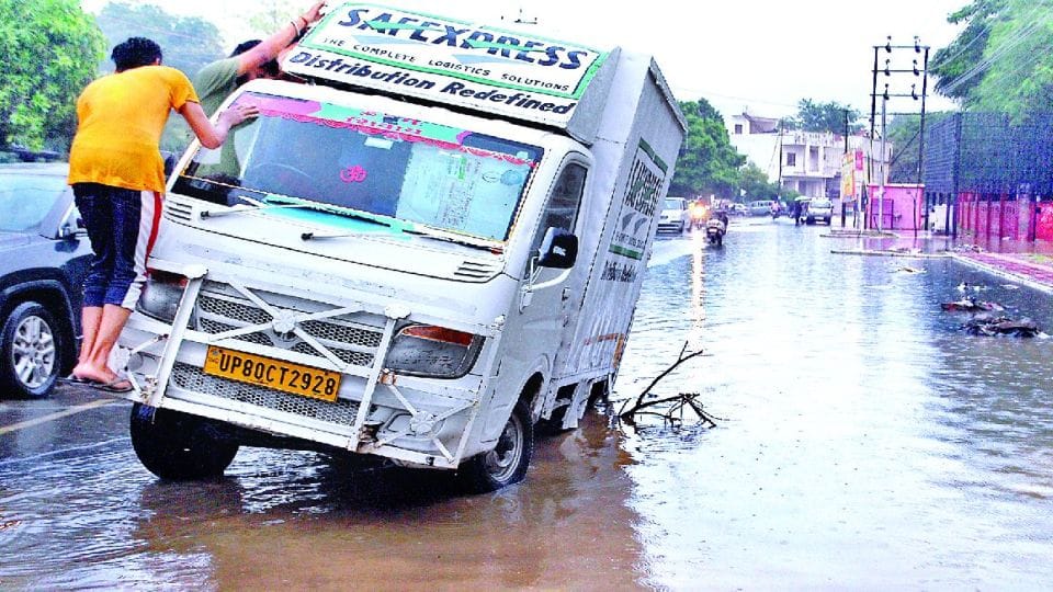 rain deepened the potholes on roads in agra