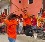 झिंझाना  में  महर्षि वाल्मीकि जयंती पर शोभयात्रा में पटा खेलते युवक।
