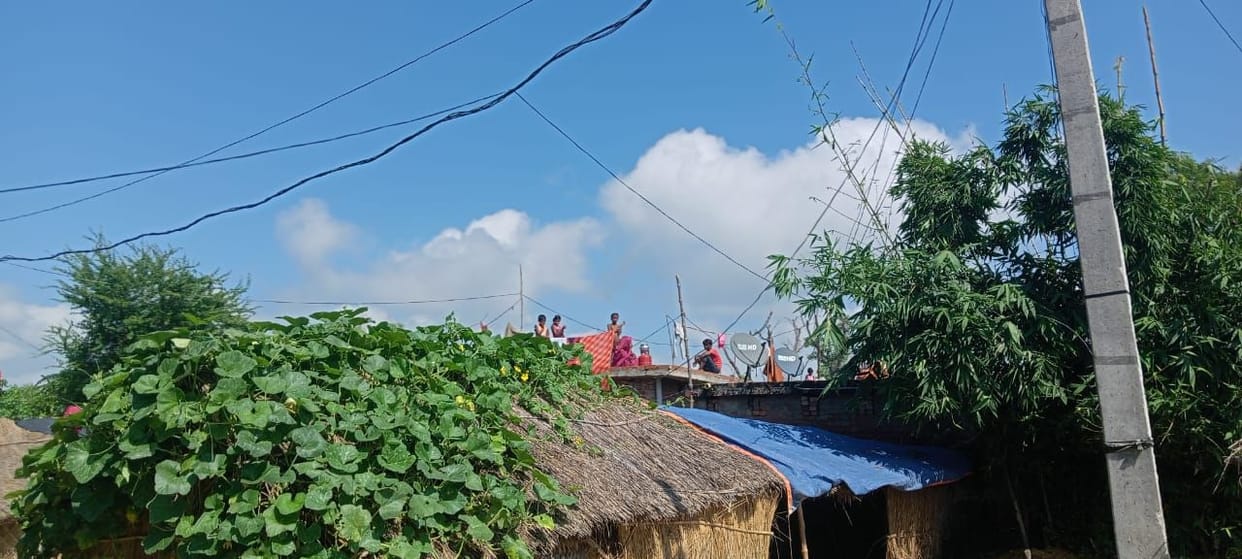 Water in homes, people living on dams and roofs