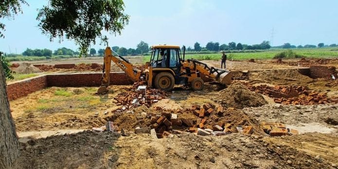 Administration run bulldozer on Chamaria road, demolish illegal construction