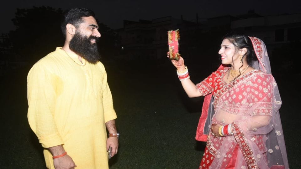 Karwa Chauth women seeing the moon and wish for husband long life in etah kasganj