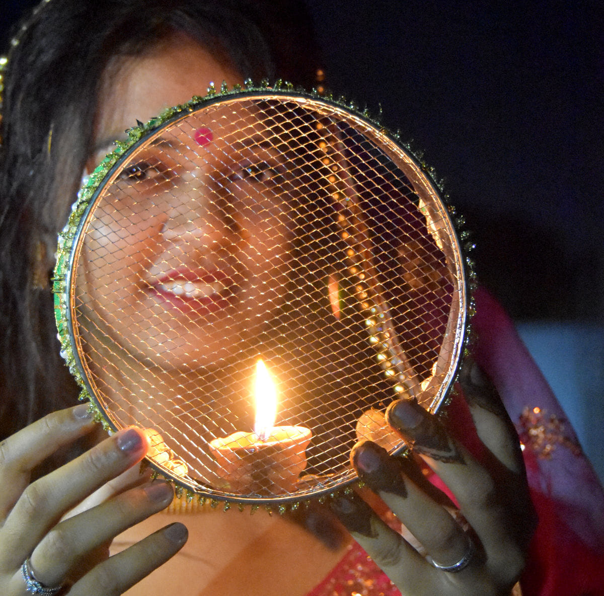 Suhagins pray for husband's long life by offering prayers