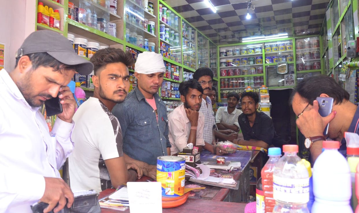 Paint market colourful, electronics lit up