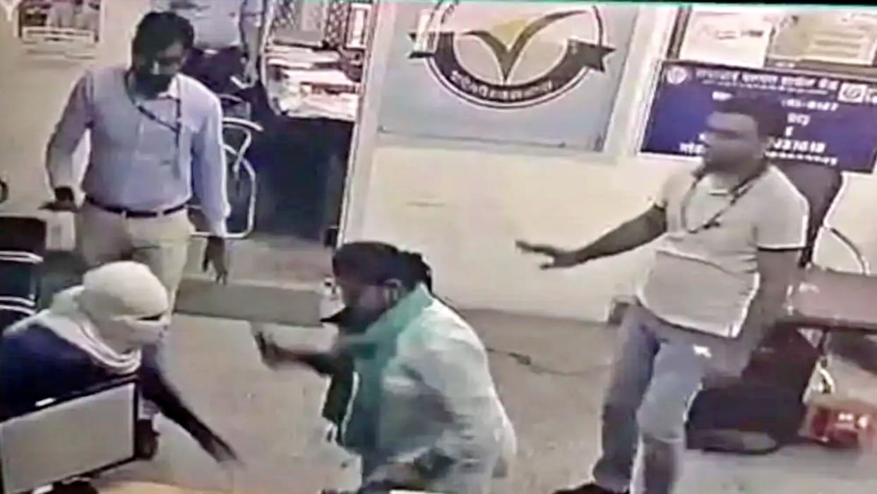 Robber enter the bank with a knife woman bank manager fight with Scissors