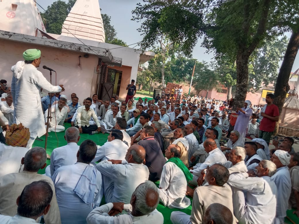 Villagers shout against waste management plant