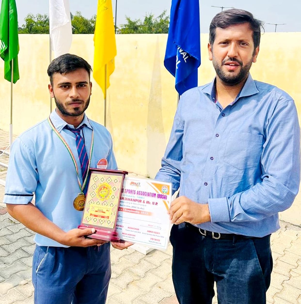 Certificate handed over by wearing head boy, girl and captain's scarf