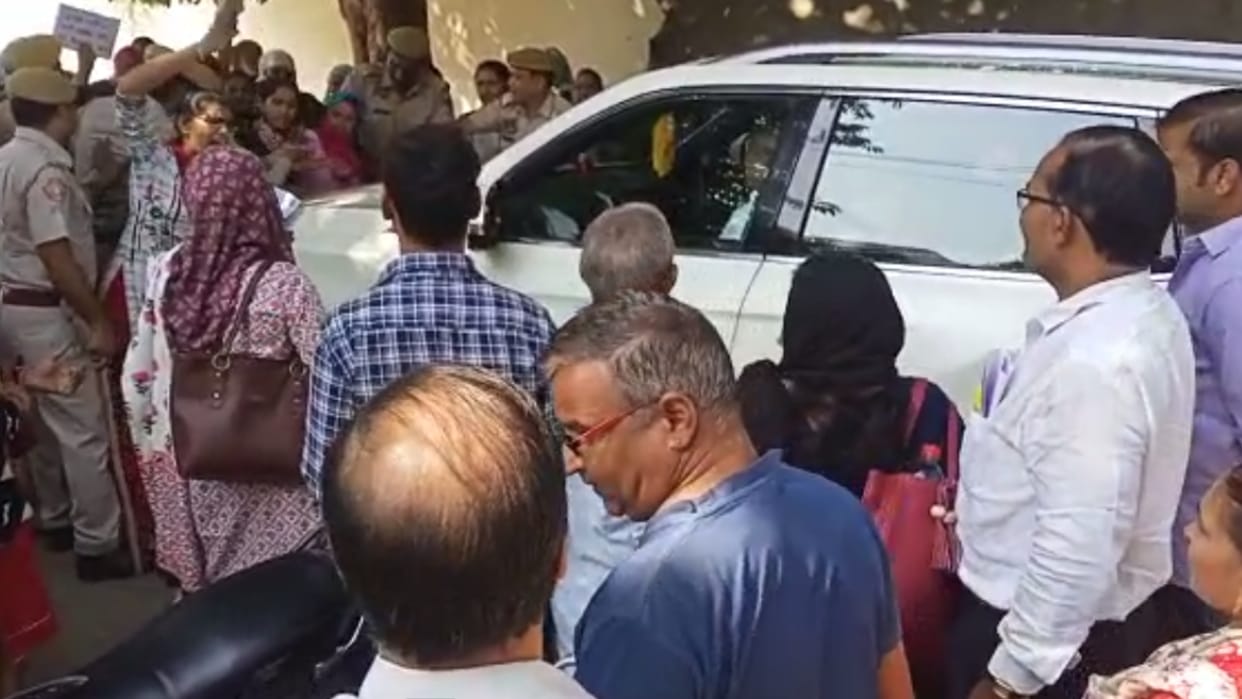 Health Minister Parsadi Lal Meena car surrounded by contract nurses
