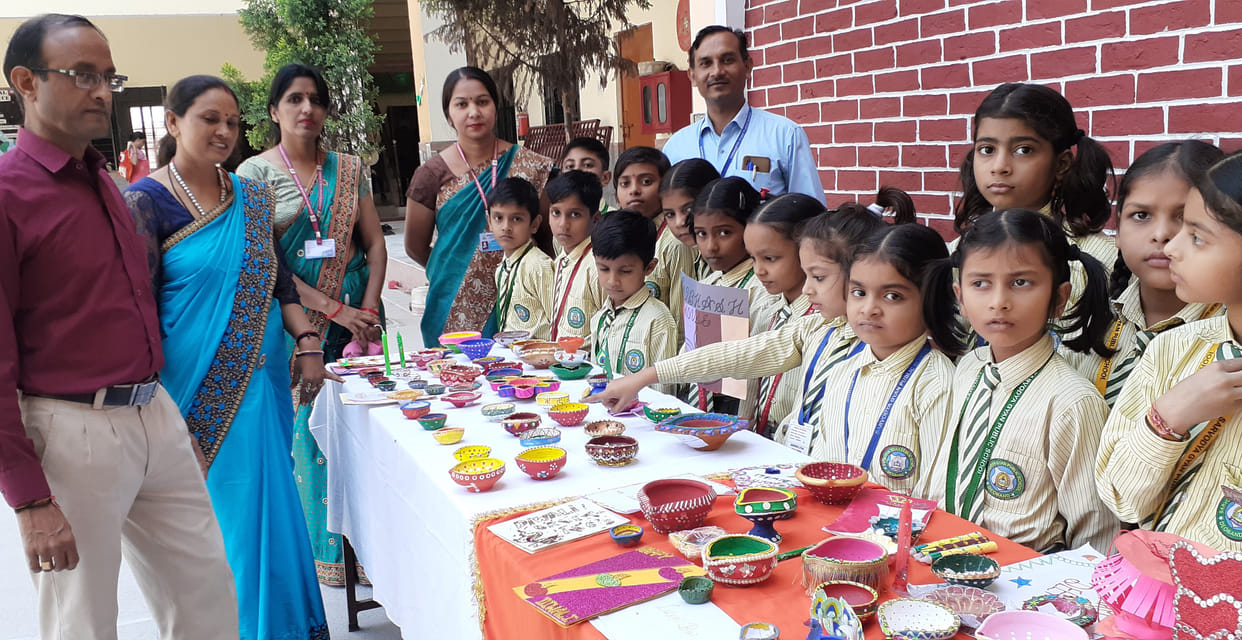 Students showed talent in Diya Decoration, Card Making and Rangoli