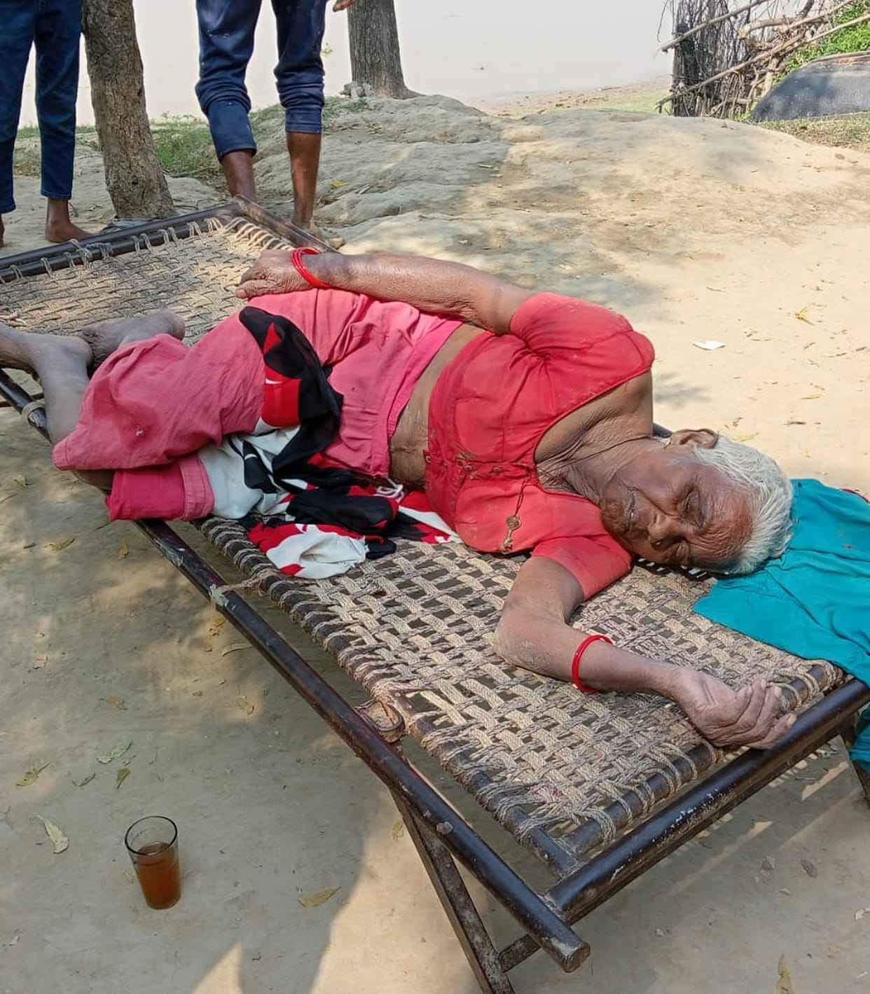 When the old woman was taken out of the river thinking of the dead body, she found her breath moving.